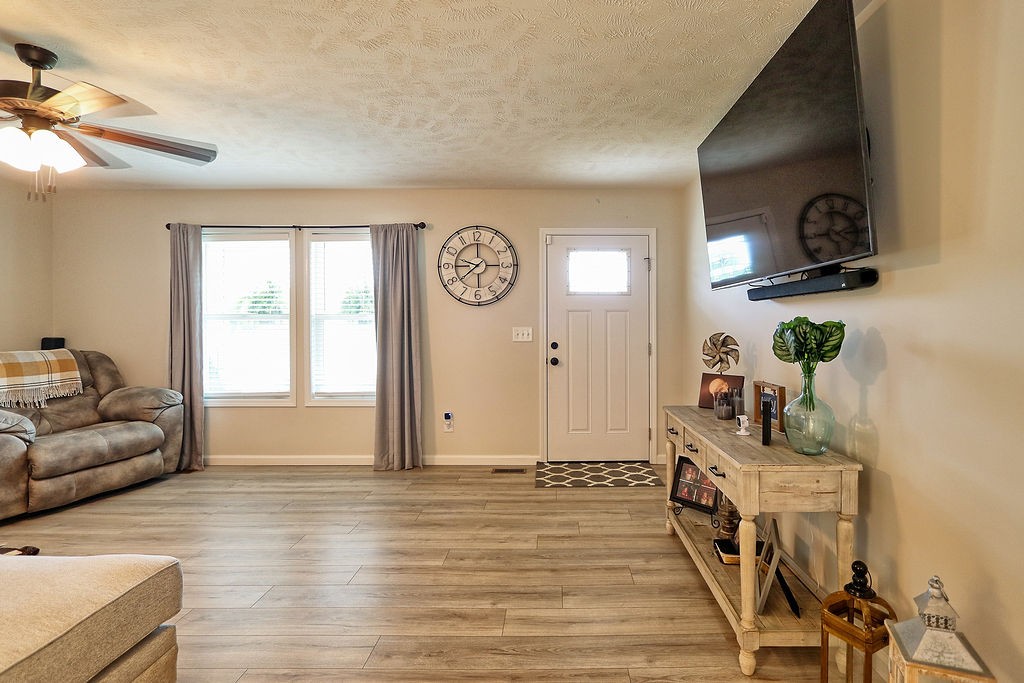 111 Heritage Hills Lane Hohenwald, TN 38462 - Photo 10 of 48 a living room with furniture and a window