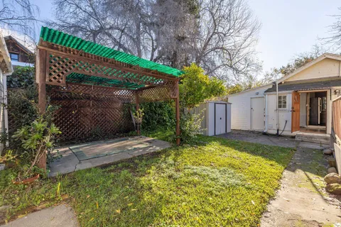 a view of a house with a yard and garage