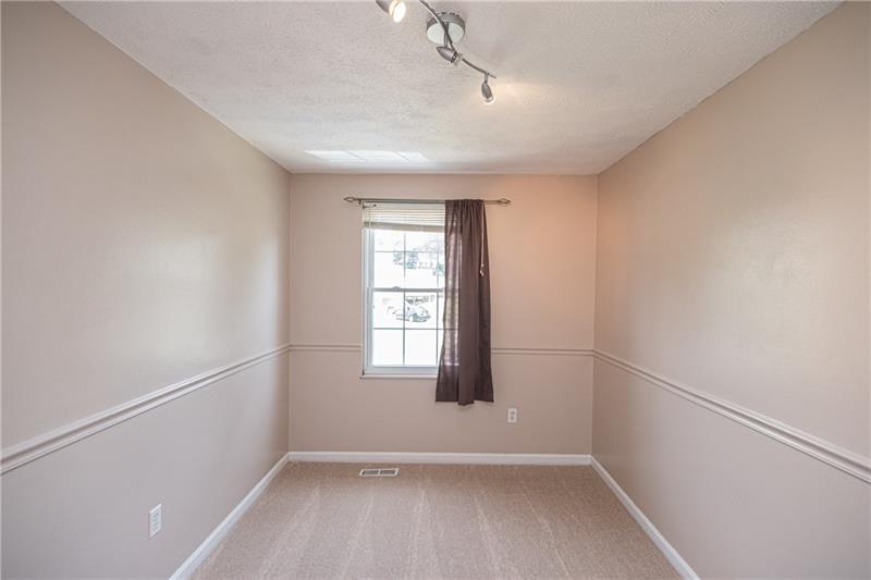 133 Old Ridge Road Coraopolis, PA 15108 - Photo 14 of 23 Bedroom #2 features overhead lighting and decorative chair rail in addition to the new neutral carpeting.