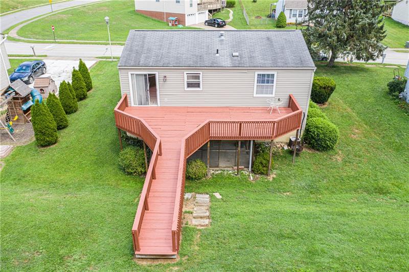 133 Old Ridge Road Coraopolis, PA 15108 - Photo 23 of 23 Rear view of the home gives a better idea of how much outdoor space this home offers and the ease of indoor/outdoor living and entertaining with the sliding door access from above and below.