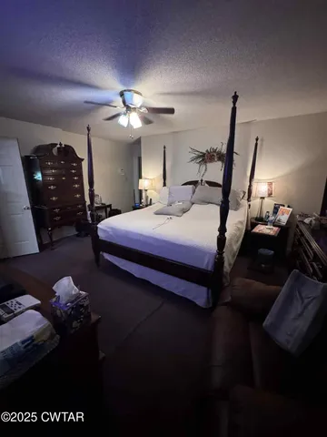 a bedroom with bed and window