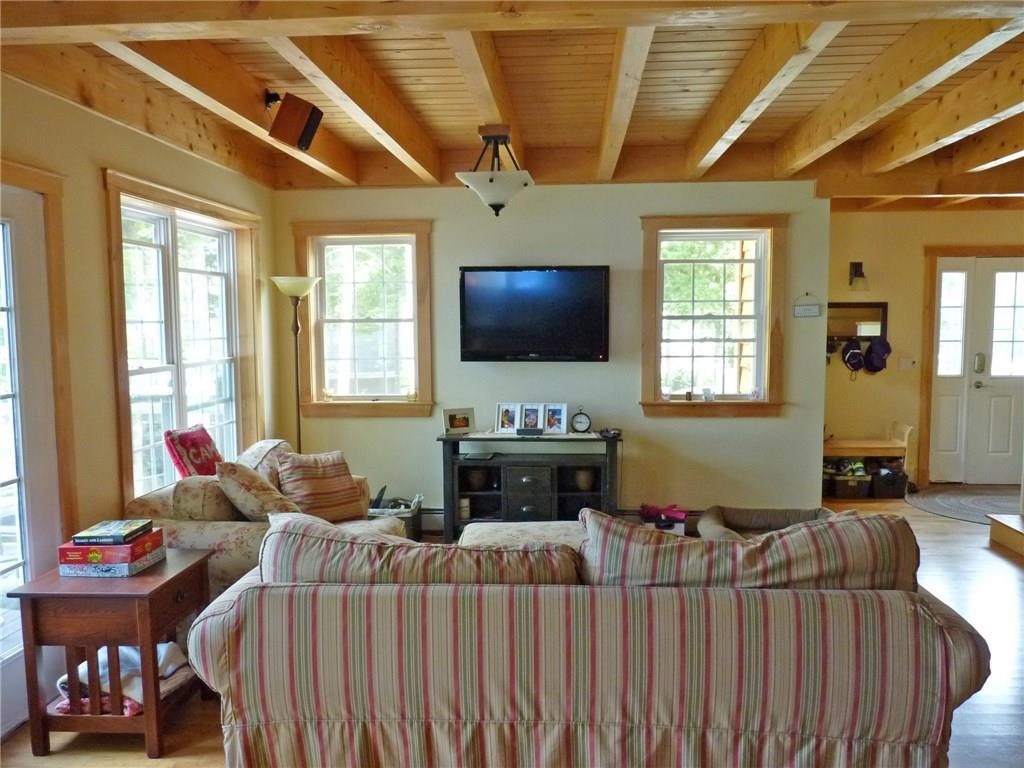 321 West Shore Road Ellsworth, ME 04605 - Photo 8 of 35 Living room with exposed beams.