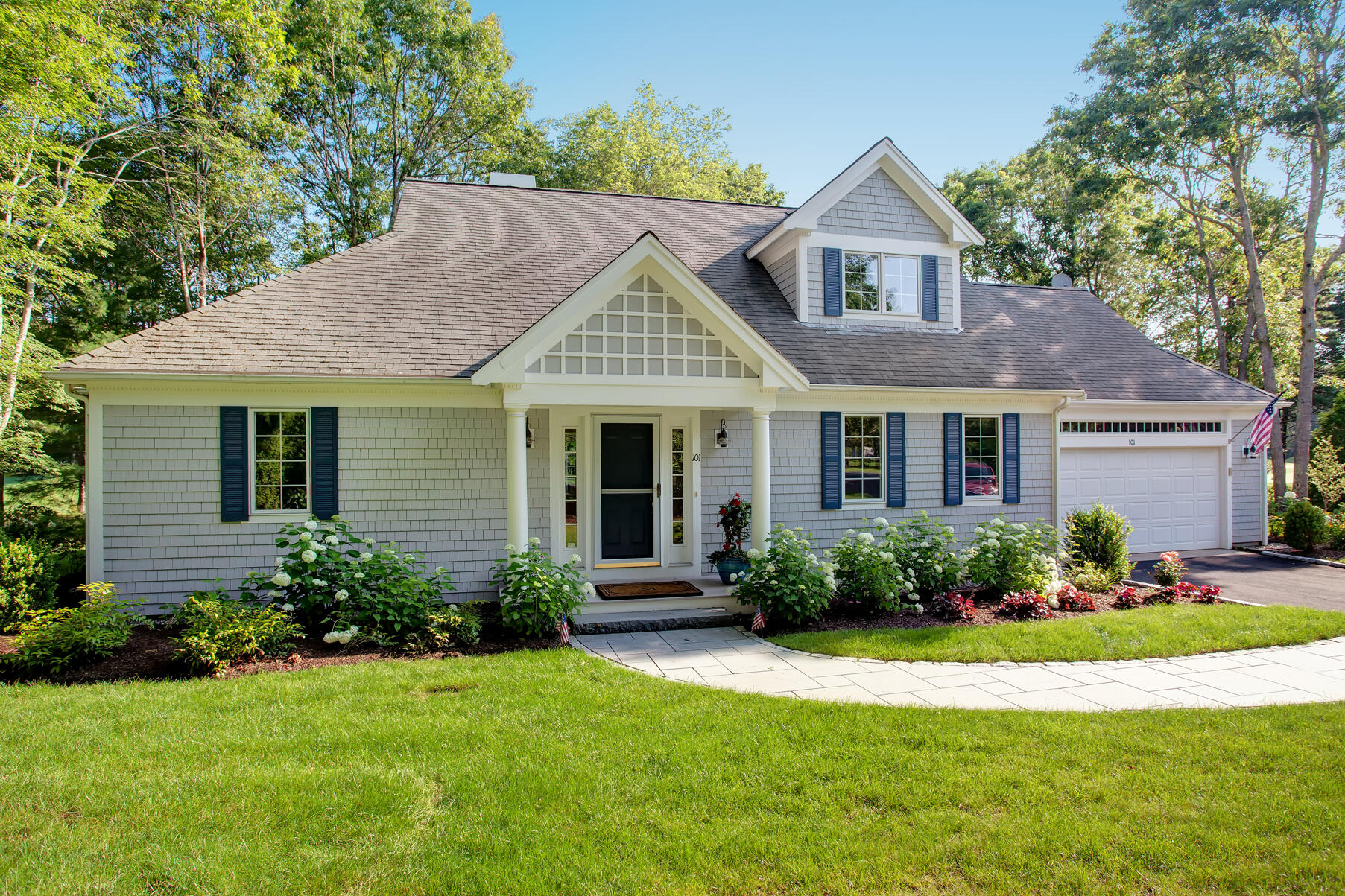 101 Reflection Drive Sandwich, MA 02563 - Photo 1 of 37 a front view of a house with a garden