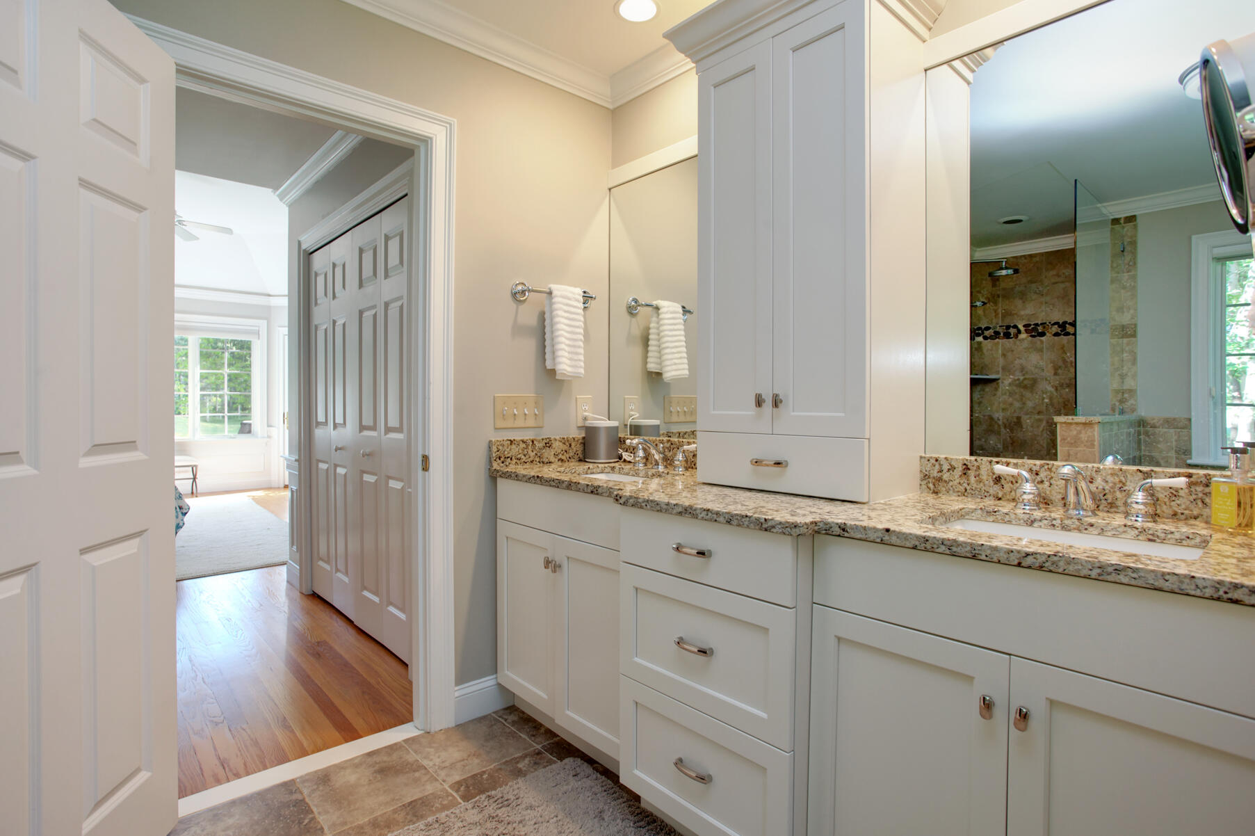 101 Reflection Drive Sandwich, MA 02563 - Photo 22 of 37 a spacious bathroom with a granite countertop sink mirror and double