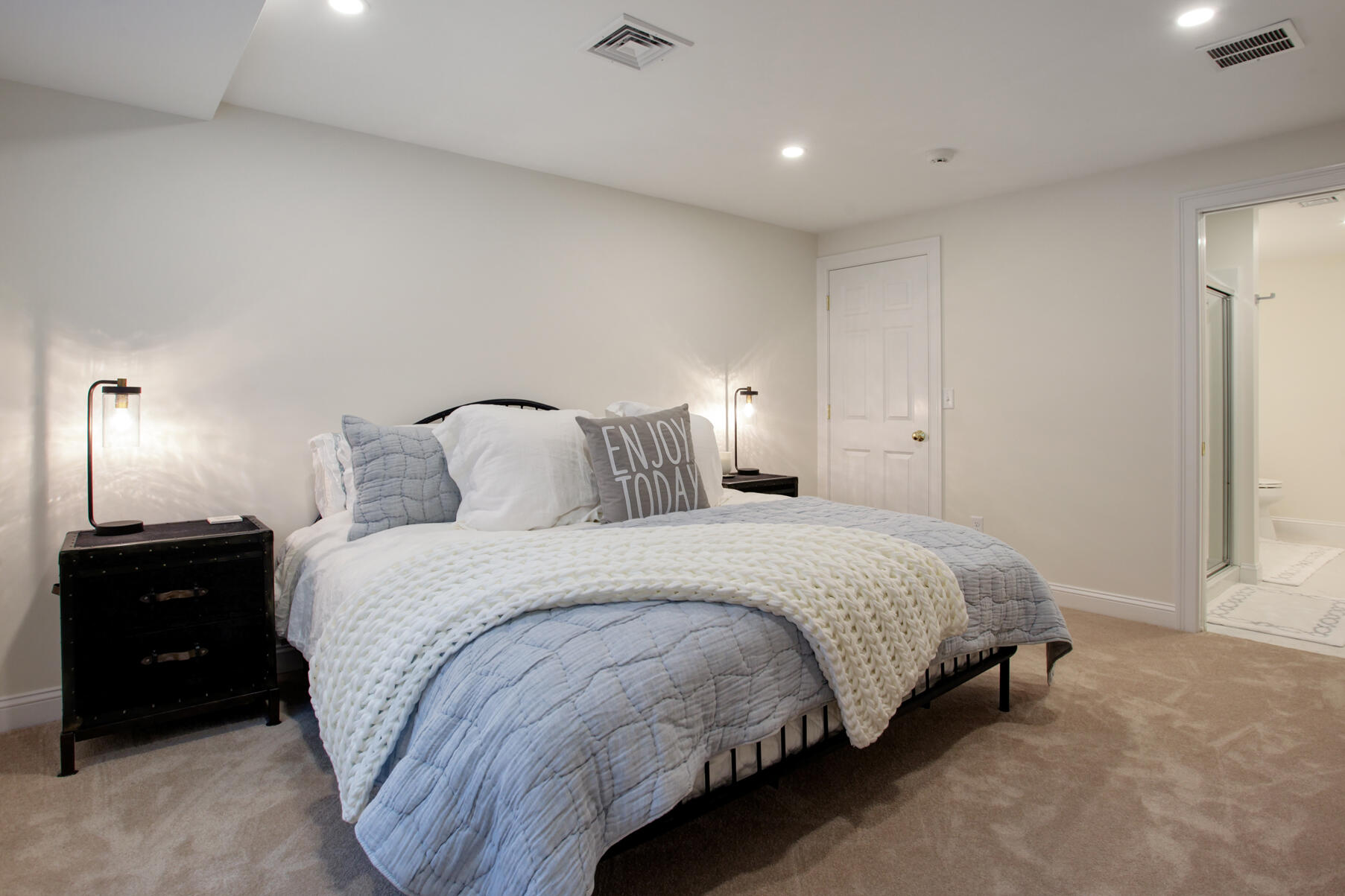 101 Reflection Drive Sandwich, MA 02563 - Photo 27 of 37 a bedroom with a bed and a lamp