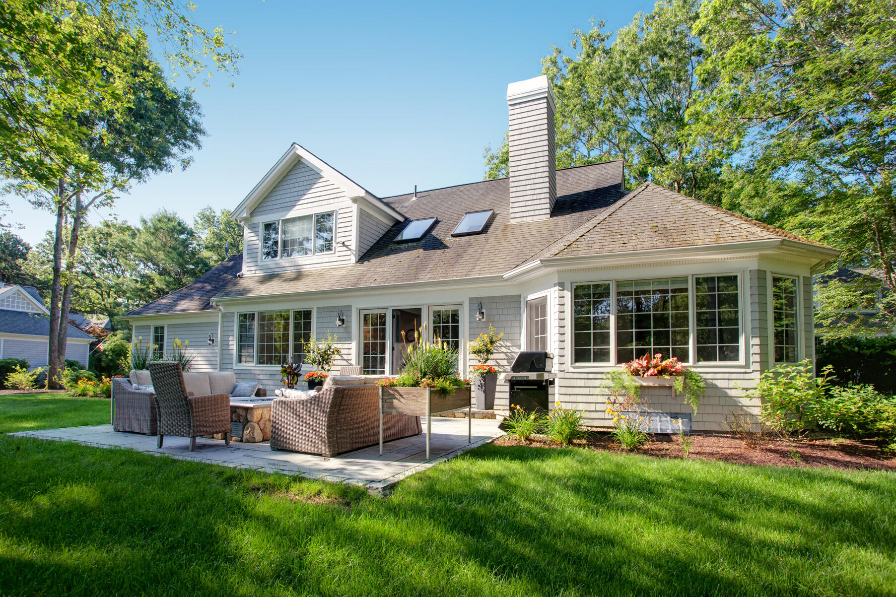 101 Reflection Drive Sandwich, MA 02563 - Photo 30 of 37 a view of a house with a backyard and a patio