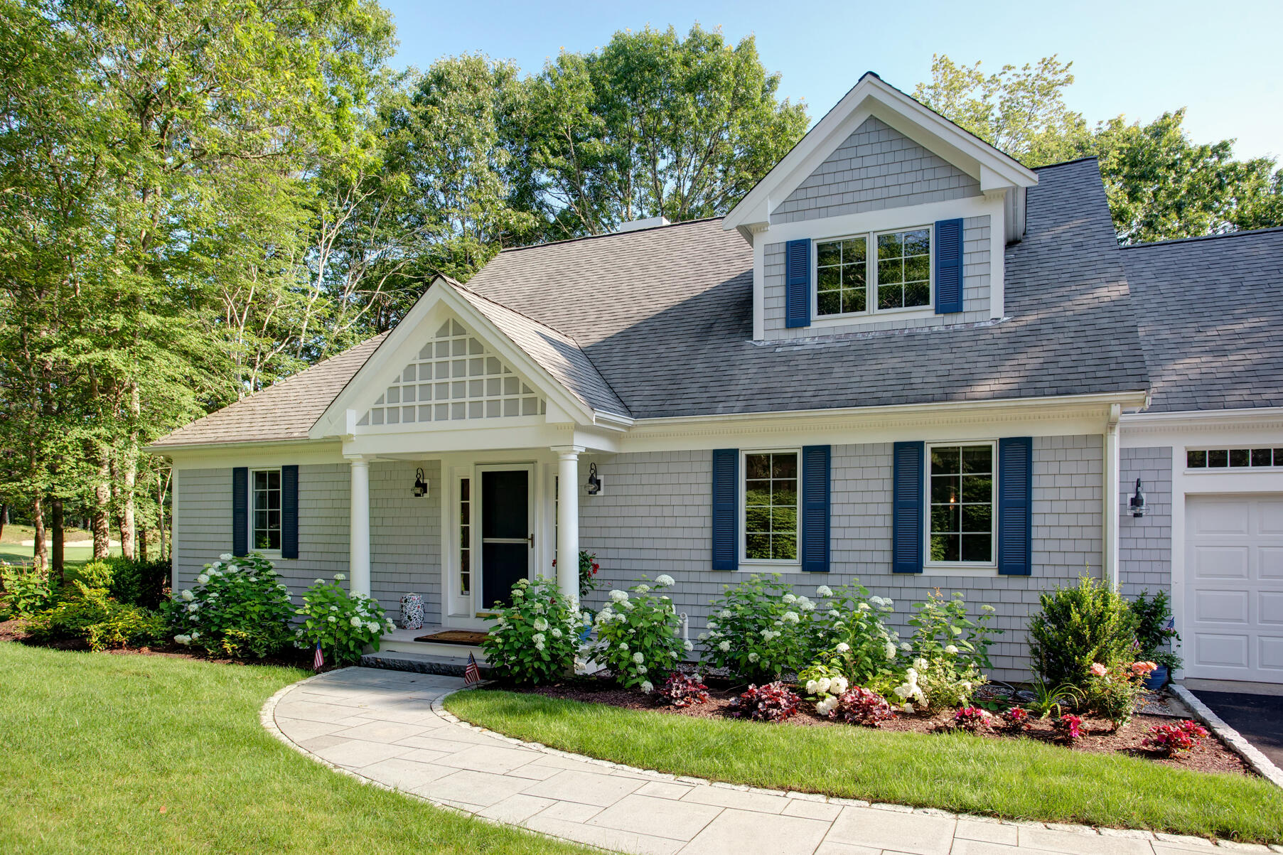 101 Reflection Drive Sandwich, MA 02563 - Photo 3 of 37 a front view of a house with garden