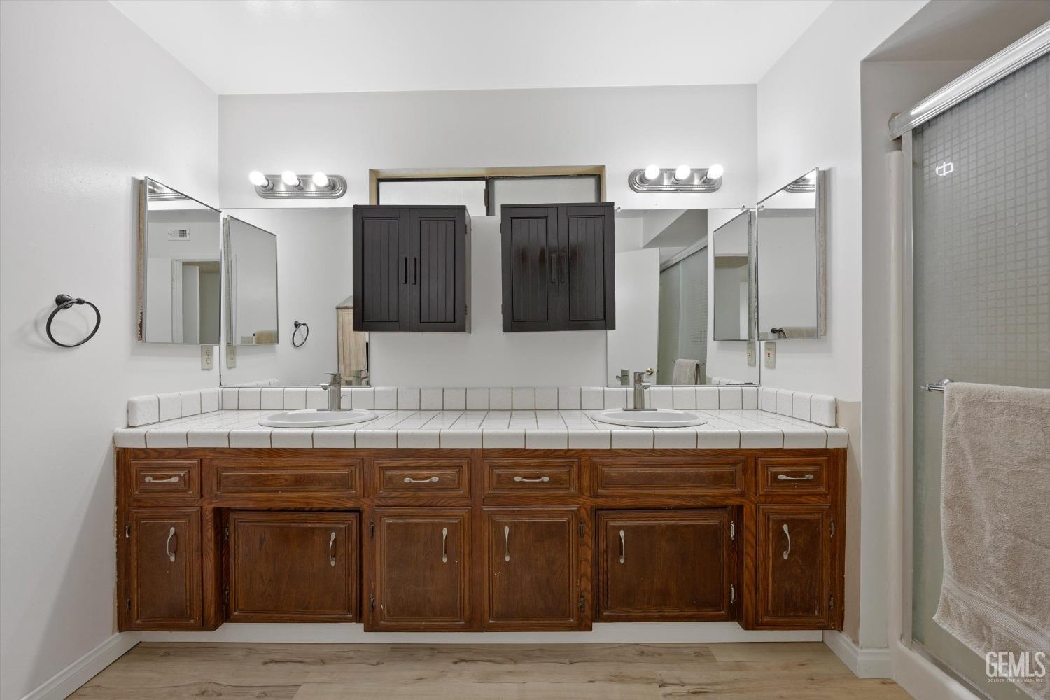 Undisclosed Address Taft, CA 93268 - Photo 20 of 36 a bathroom with a granite countertop sink a large mirror and a