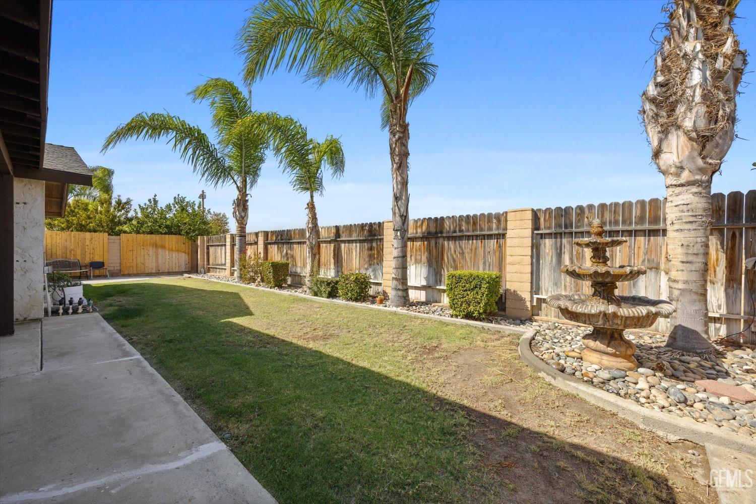 Undisclosed Address Taft, CA 93268 - Photo 33 of 36 a view of a house with a patio and a yard