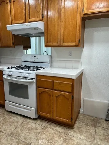 a kitchen with a stove and a sink