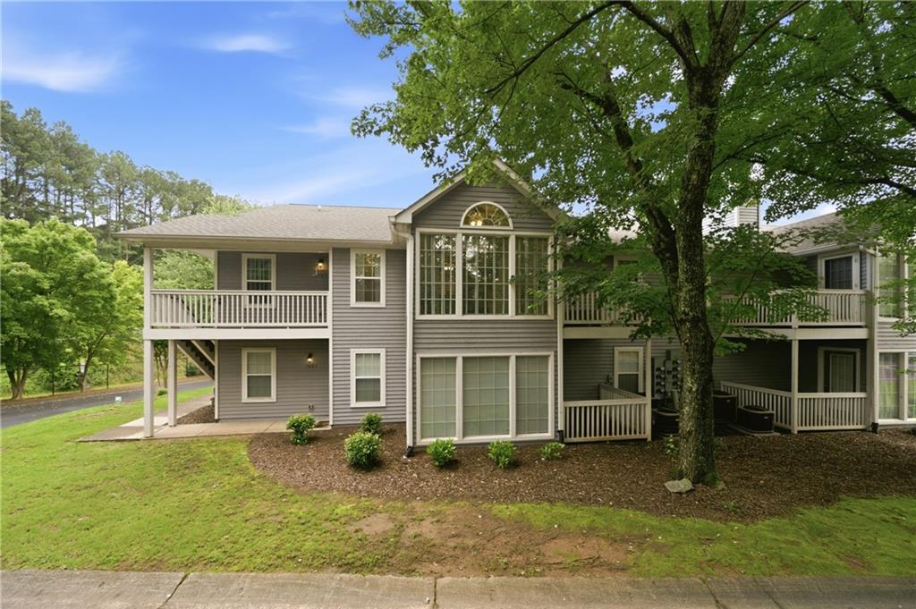 1007 Olde Mill Lane Norcross, GA 30093 - Photo 31 of 32 a front view of a house with a yard