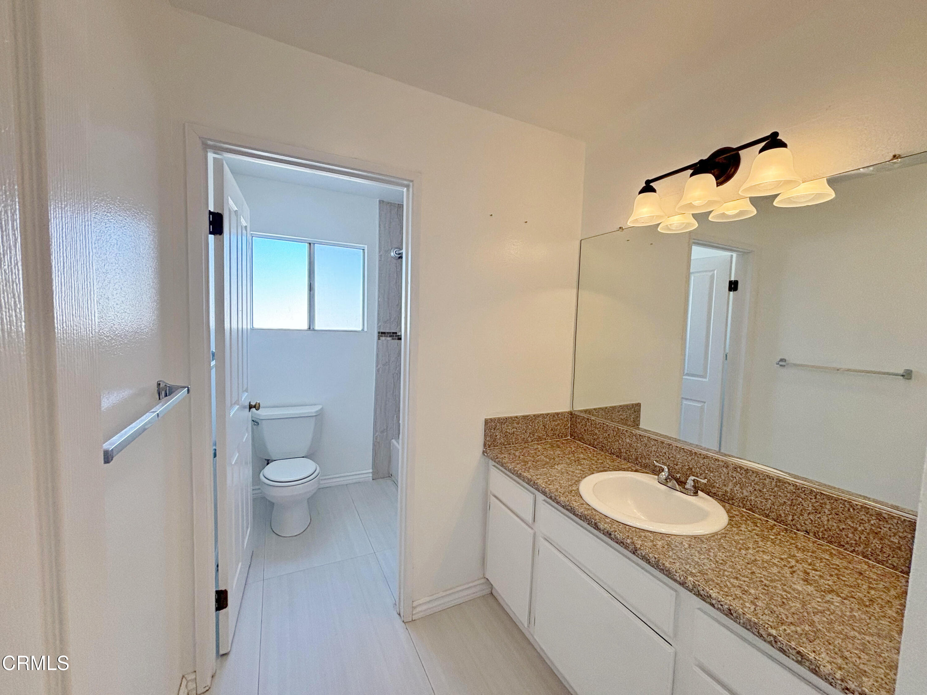 330 California Street, Unit B Arcadia, CA 91006 - Photo 14 of 18 a bathroom with a granite countertop sink and a mirror