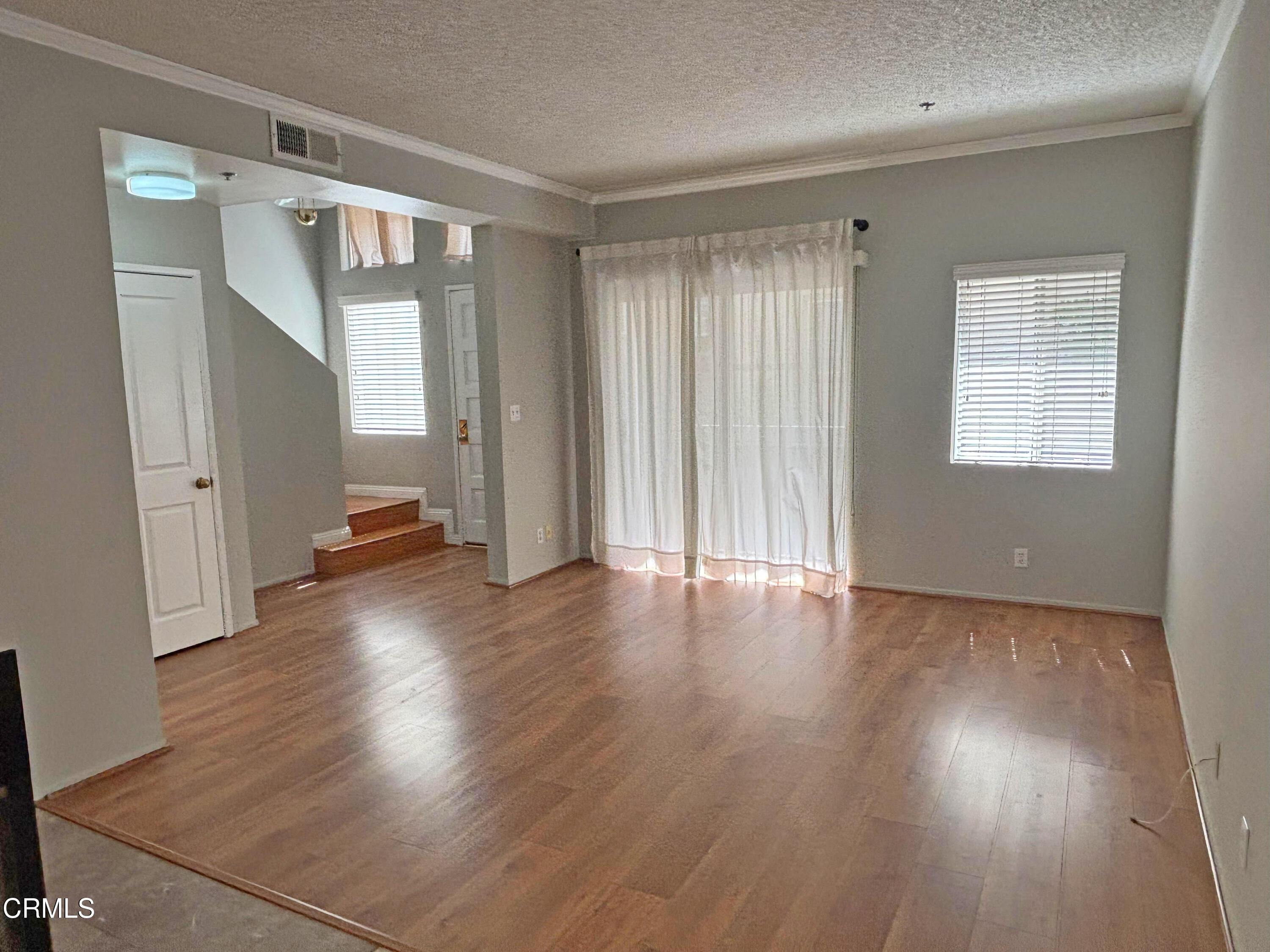 330 California Street, Unit B Arcadia, CA 91006 - Photo 3 of 18 an empty room with wooden floor and windows