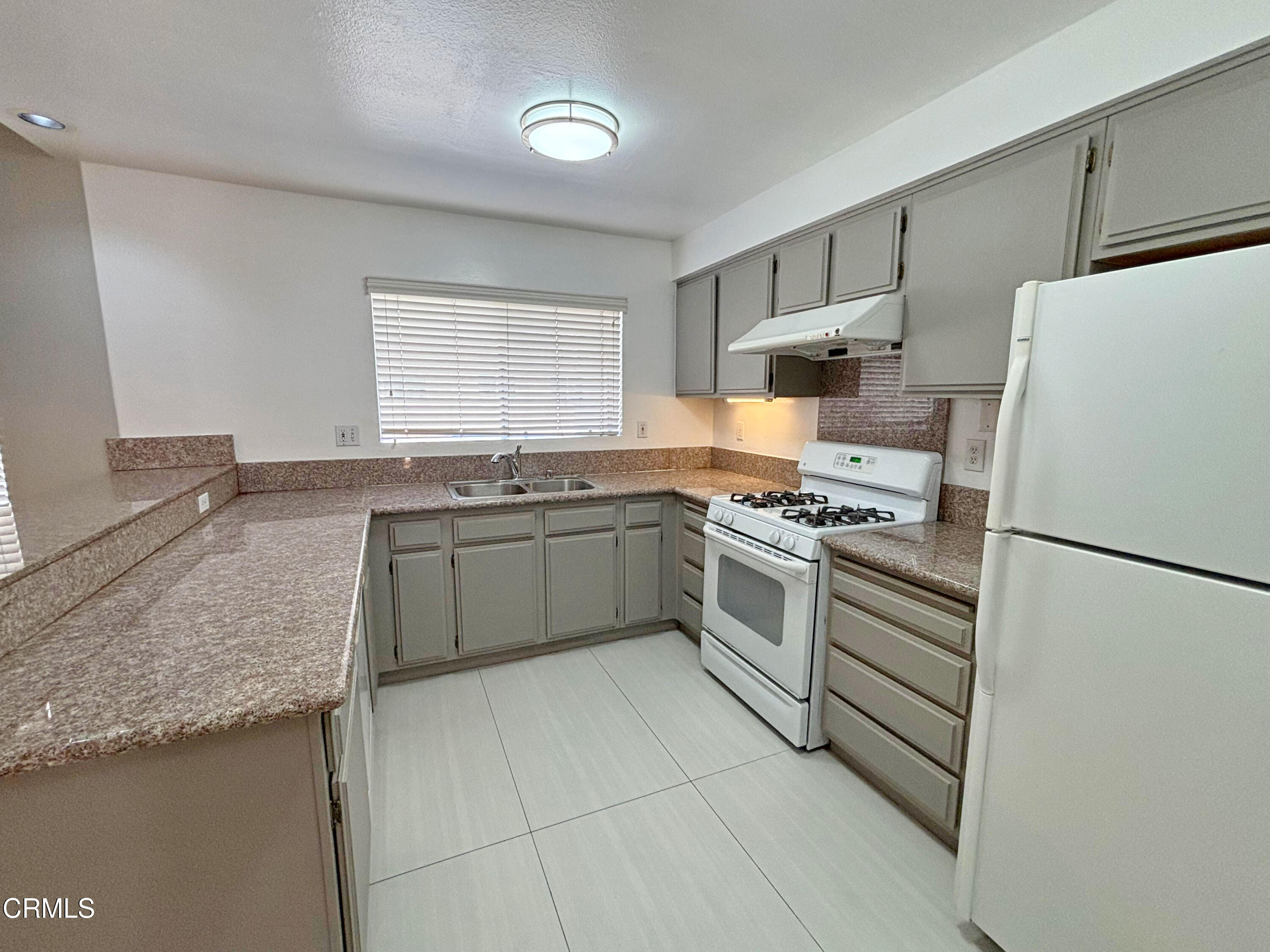 330 California Street, Unit B Arcadia, CA 91006 - Photo 5 of 18 a kitchen with granite countertop a sink stainless steel appliances and cabinets