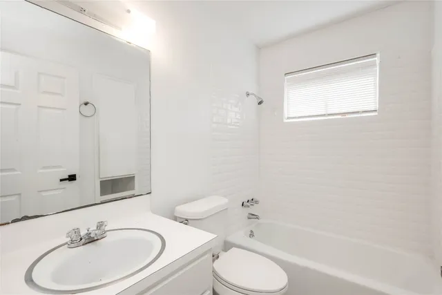 a view of backyard with wooden fence