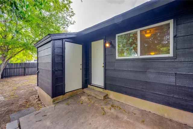 a house with trees in the background