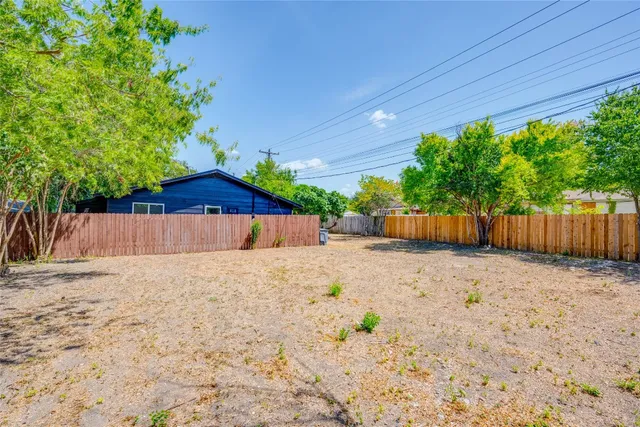 a backyard of a house with lots of green space