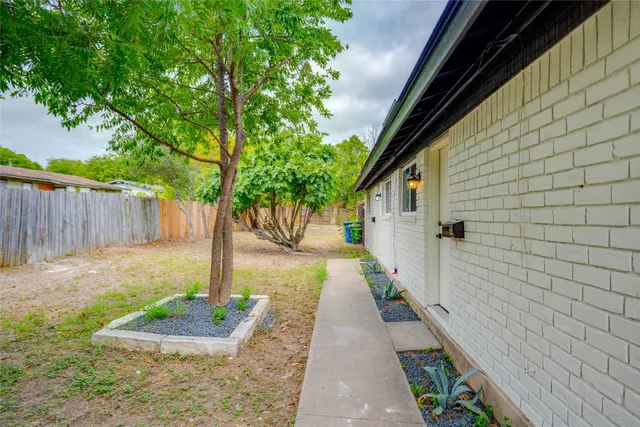 a front view of a house with a yard and a garage
