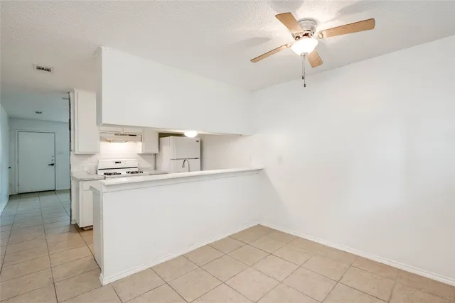 a kitchen with a sink cabinets and appliances