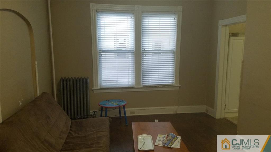 59 Handy Street New Brunswick, NJ 08901 - Photo 2 of 10 a view of an empty room with a window