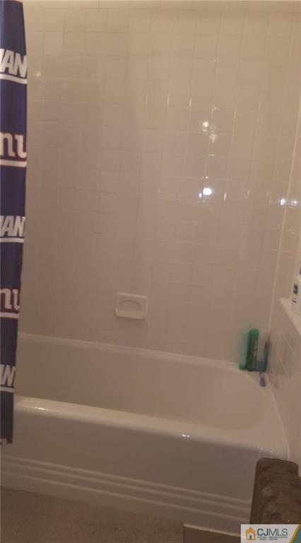 59 Handy Street New Brunswick, NJ 08901 - Photo 8 of 10 a bathroom with a bathtub