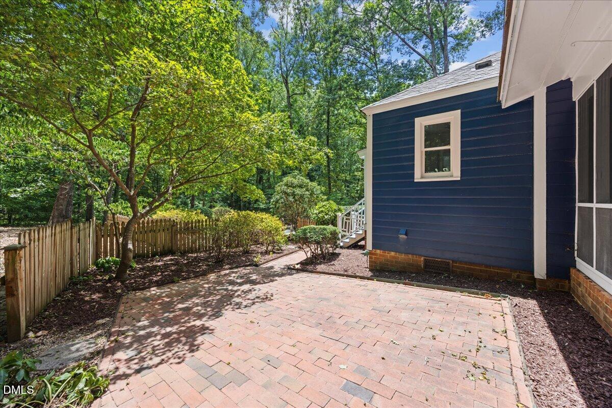 6516 Bakersfield Drive Raleigh, NC 27606 - Photo 45 of 59 a view of a backyard of the house