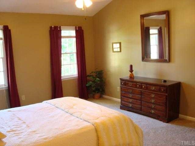 6648 Speight Circle Raleigh, NC 27616 - Photo 11 of 12 Large master bedroom with vaulted ceiling. This room easily accomadates a king size bed!