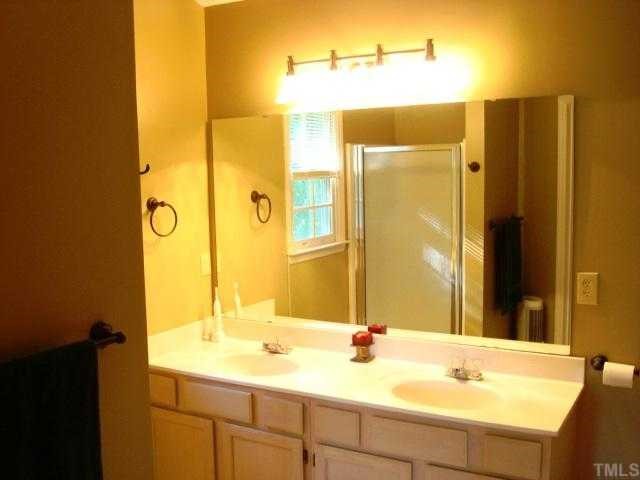 6648 Speight Circle Raleigh, NC 27616 - Photo 12 of 12 The master bath features dual vanity sinks, separate tub and shower.