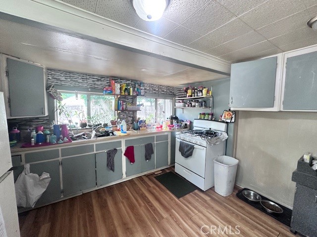 1414 Almond Street Chico, CA 95928 - Photo 2 of 11 a kitchen with a sink stove and cabinets