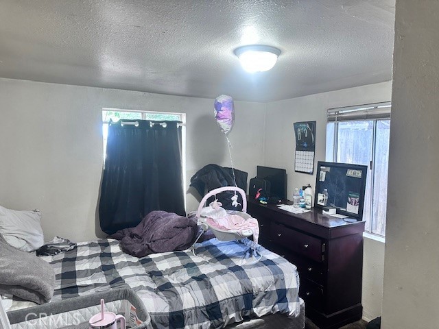 1414 Almond Street Chico, CA 95928 - Photo 4 of 11 a bedroom with a bed and dresser