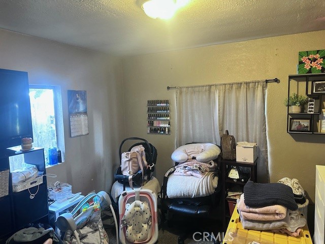 1414 Almond Street Chico, CA 95928 - Photo 5 of 11 a bed room with two beds and a wall painting