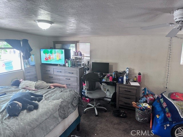 1414 Almond Street Chico, CA 95928 - Photo 6 of 11 a bedroom with a bed furniture and a flat screen tv