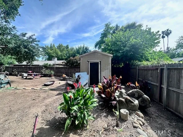 a view of a backyard with sitting area and furniture