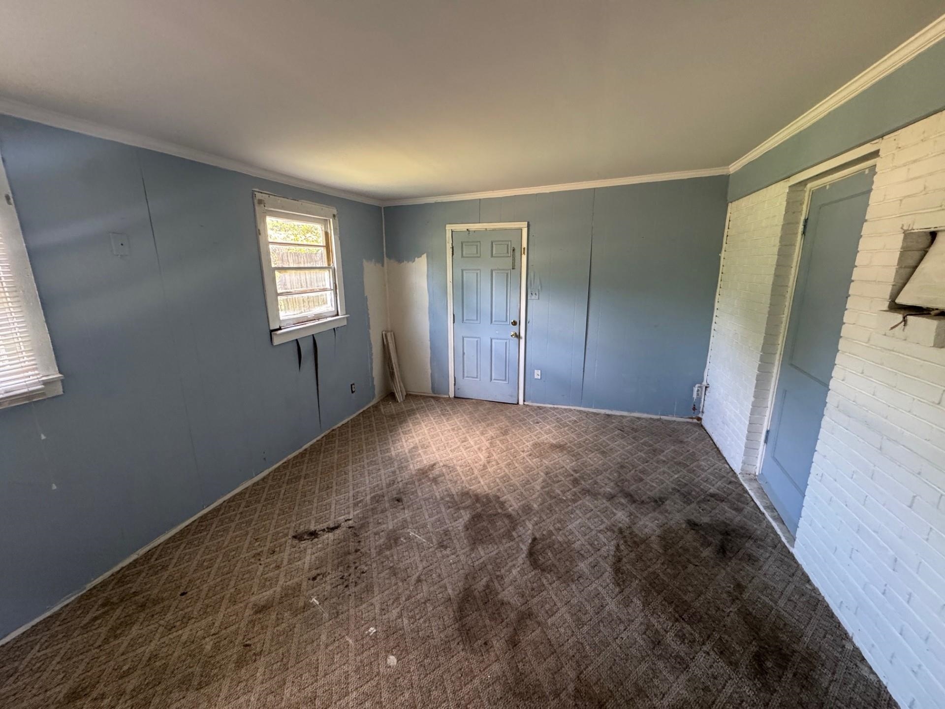 994 North Perkins Road Memphis, TN 38122 - Photo 4 of 15 Unfurnished bedroom with ornamental molding and carpet flooring