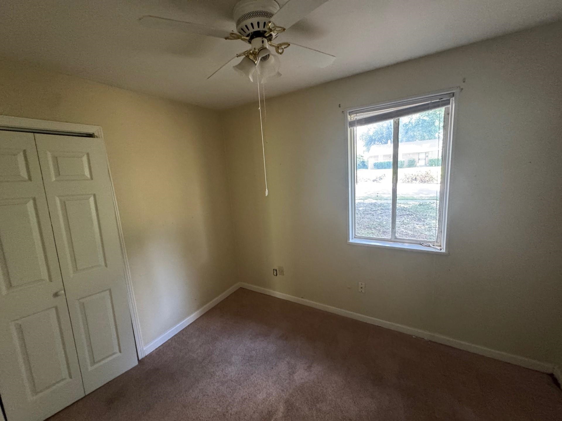 994 North Perkins Road Memphis, TN 38122 - Photo 10 of 15 Carpeted empty room with a ceiling fan and baseboards
