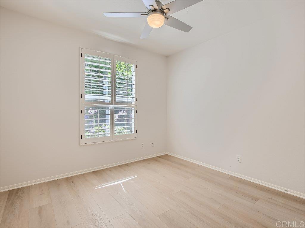 6562 Windflower Drive Carlsbad, CA 92011 - Photo 12 of 28 an empty room with a window and a fan