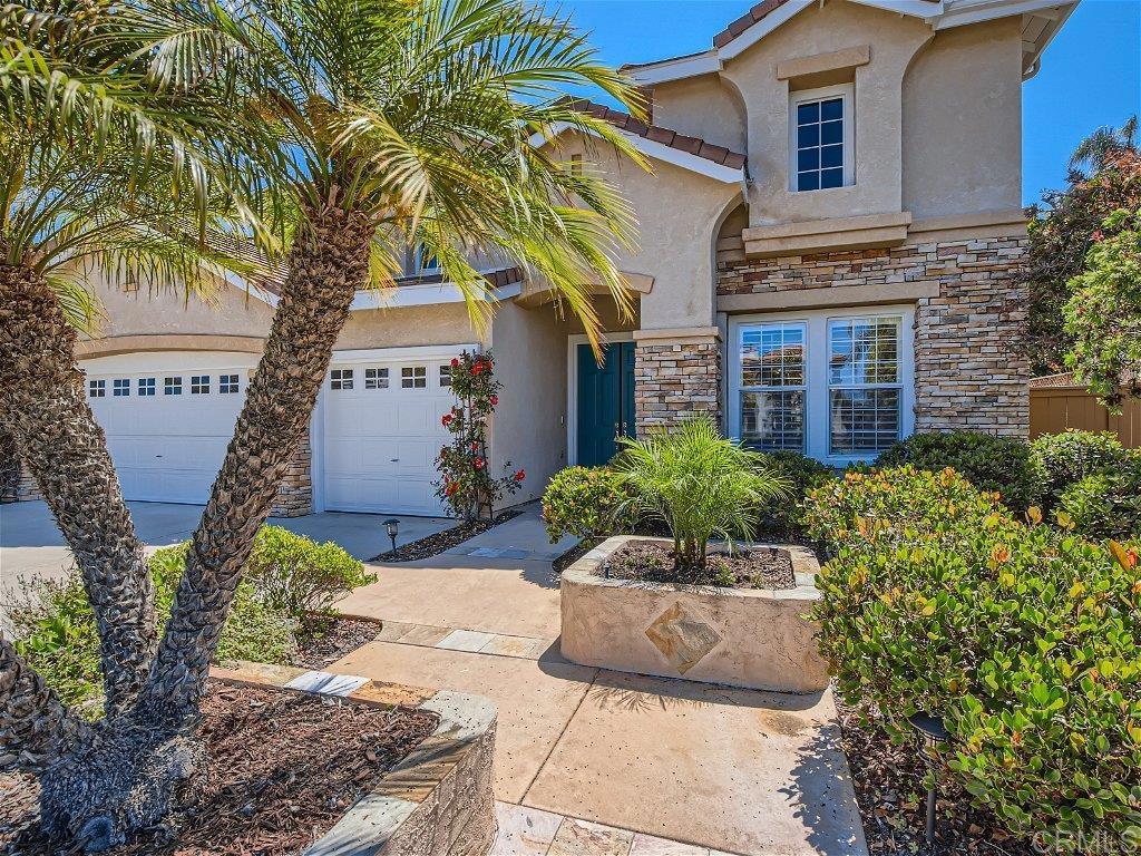 6562 Windflower Drive Carlsbad, CA 92011 - Photo 2 of 28 a view of a house with potted plants