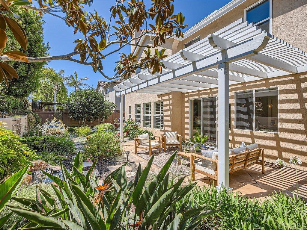 6562 Windflower Drive Carlsbad, CA 92011 - Photo 25 of 28 a view of a backyard with sitting area