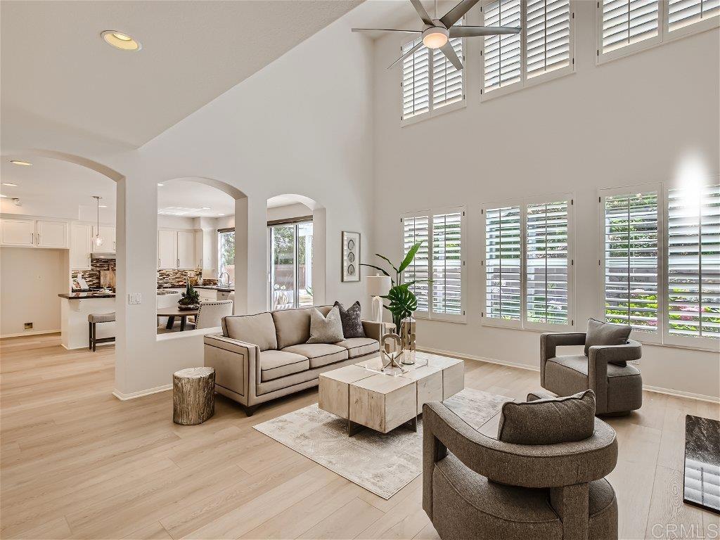 6562 Windflower Drive Carlsbad, CA 92011 - Photo 4 of 28 a living room with furniture and a large window