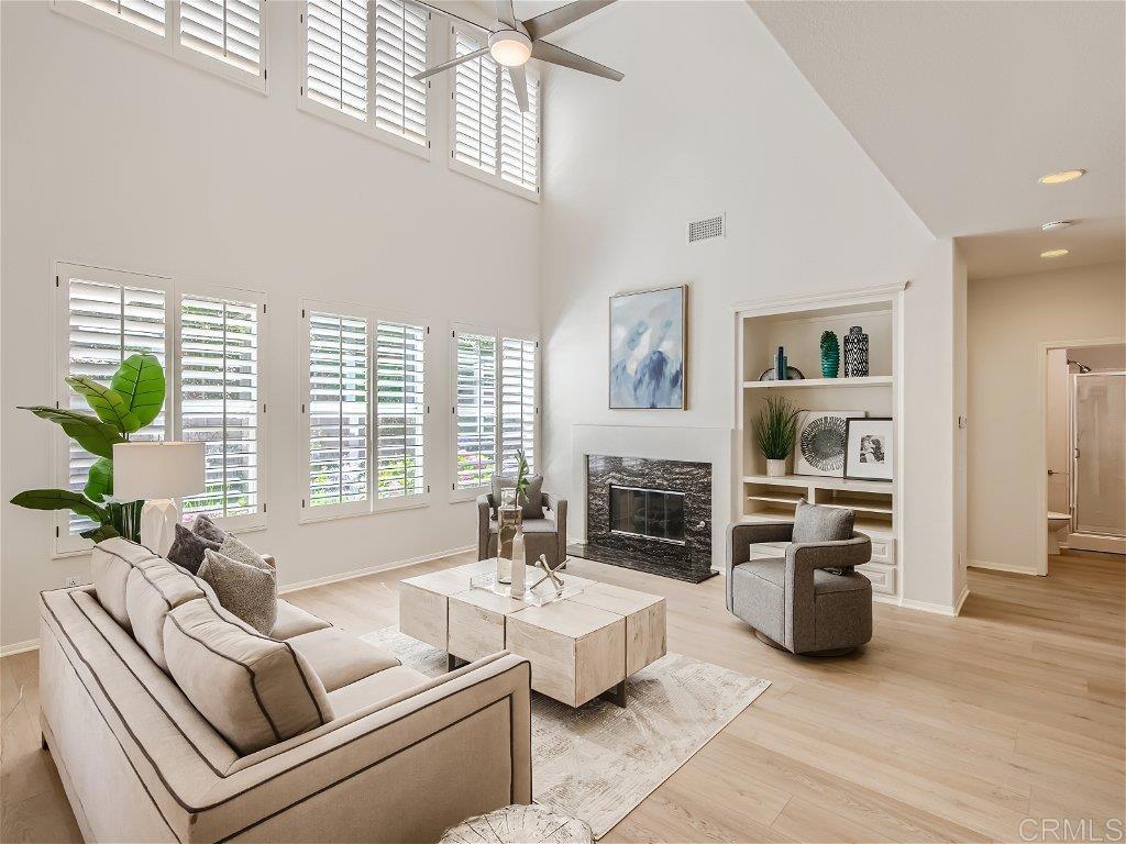 6562 Windflower Drive Carlsbad, CA 92011 - Photo 5 of 28 a living room with furniture and a fireplace