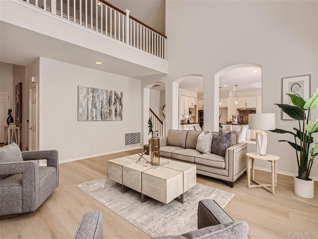 6562 Windflower Drive Carlsbad, CA 92011 - Photo 6 of 28 a living room with furniture and a potted plant