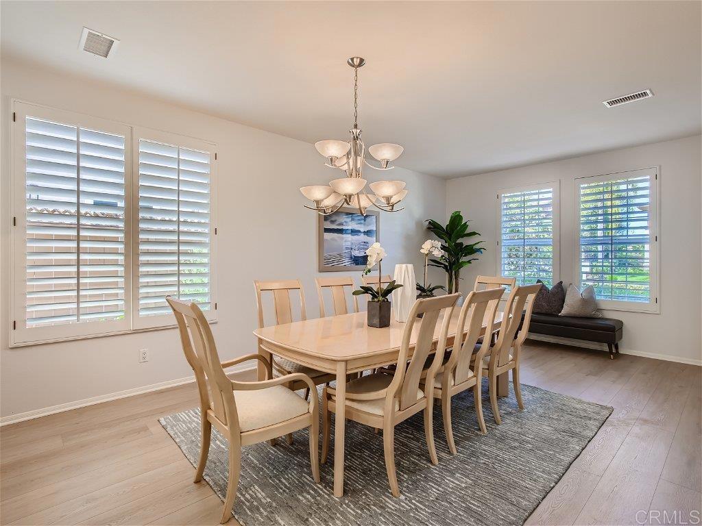 6562 Windflower Drive Carlsbad, CA 92011 - Photo 7 of 28 a view of a dining room with furniture window and outside view