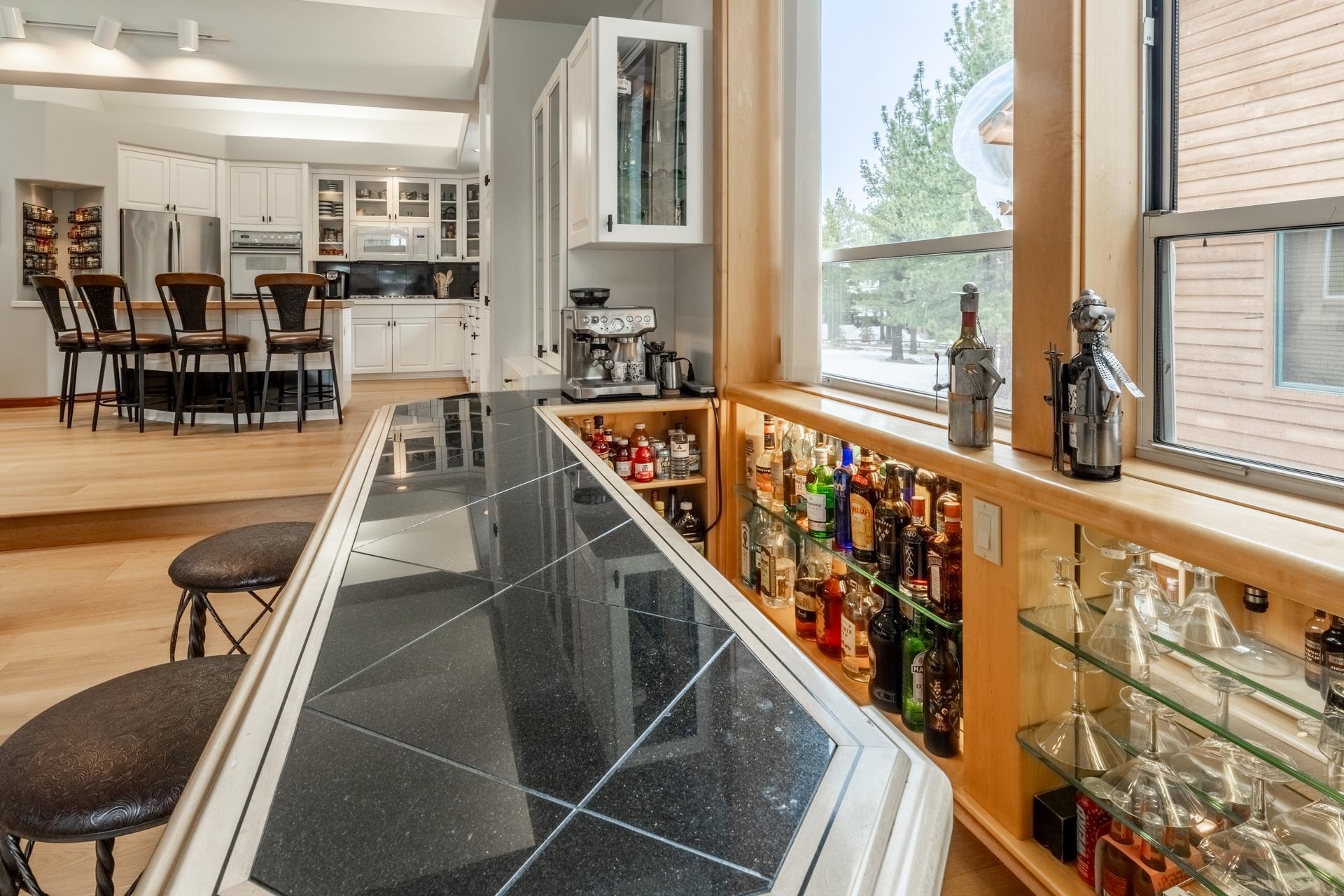 244 Ridge Way Mammoth Lakes, CA 93546 - Photo 13 of 49 Indoor dry bar featuring glass fronted cabinets, white appliances, white cabinetry, and dark countertops