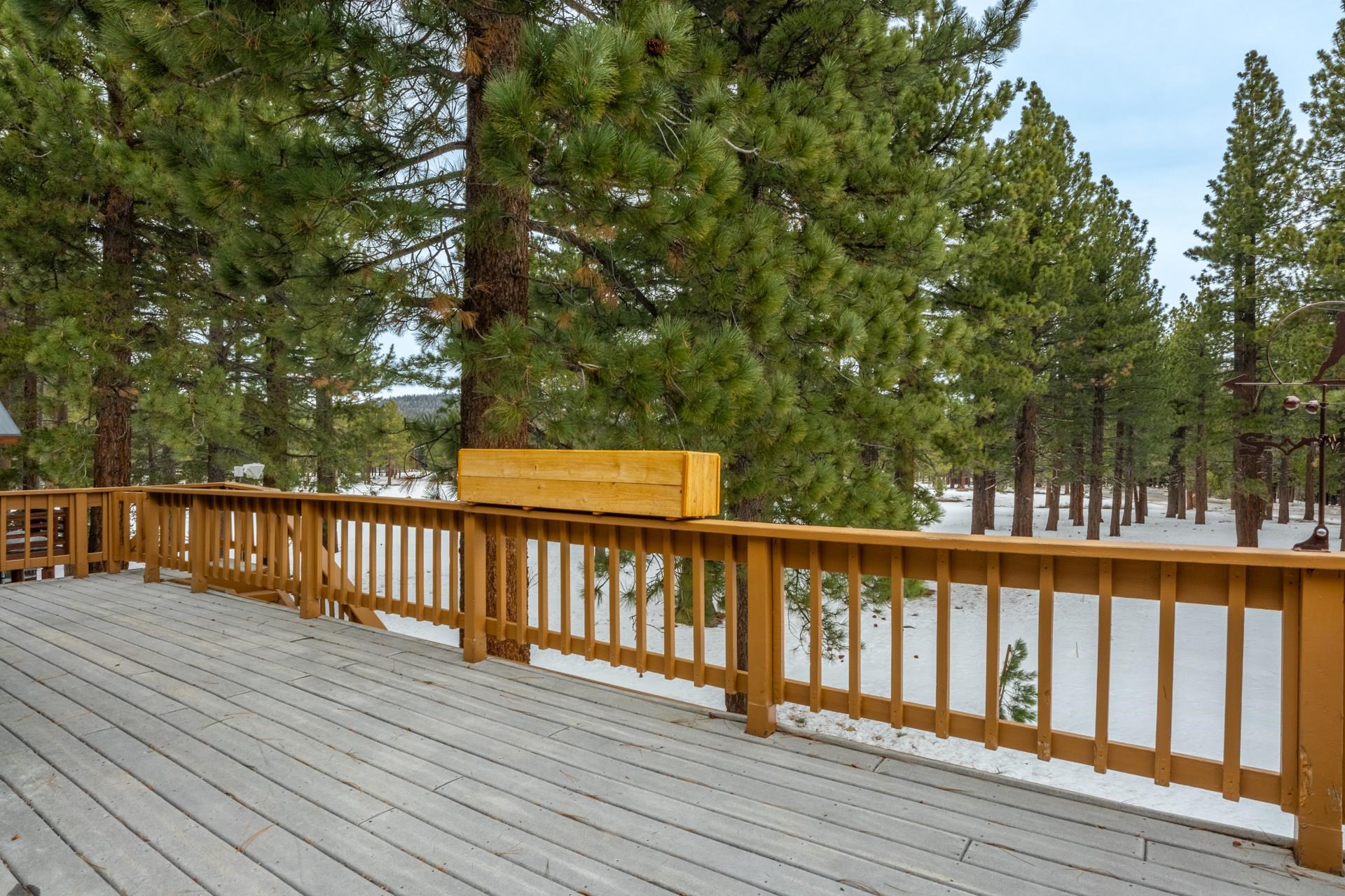244 Ridge Way Mammoth Lakes, CA 93546 - Photo 26 of 49 Snow covered deck with view of wooded area