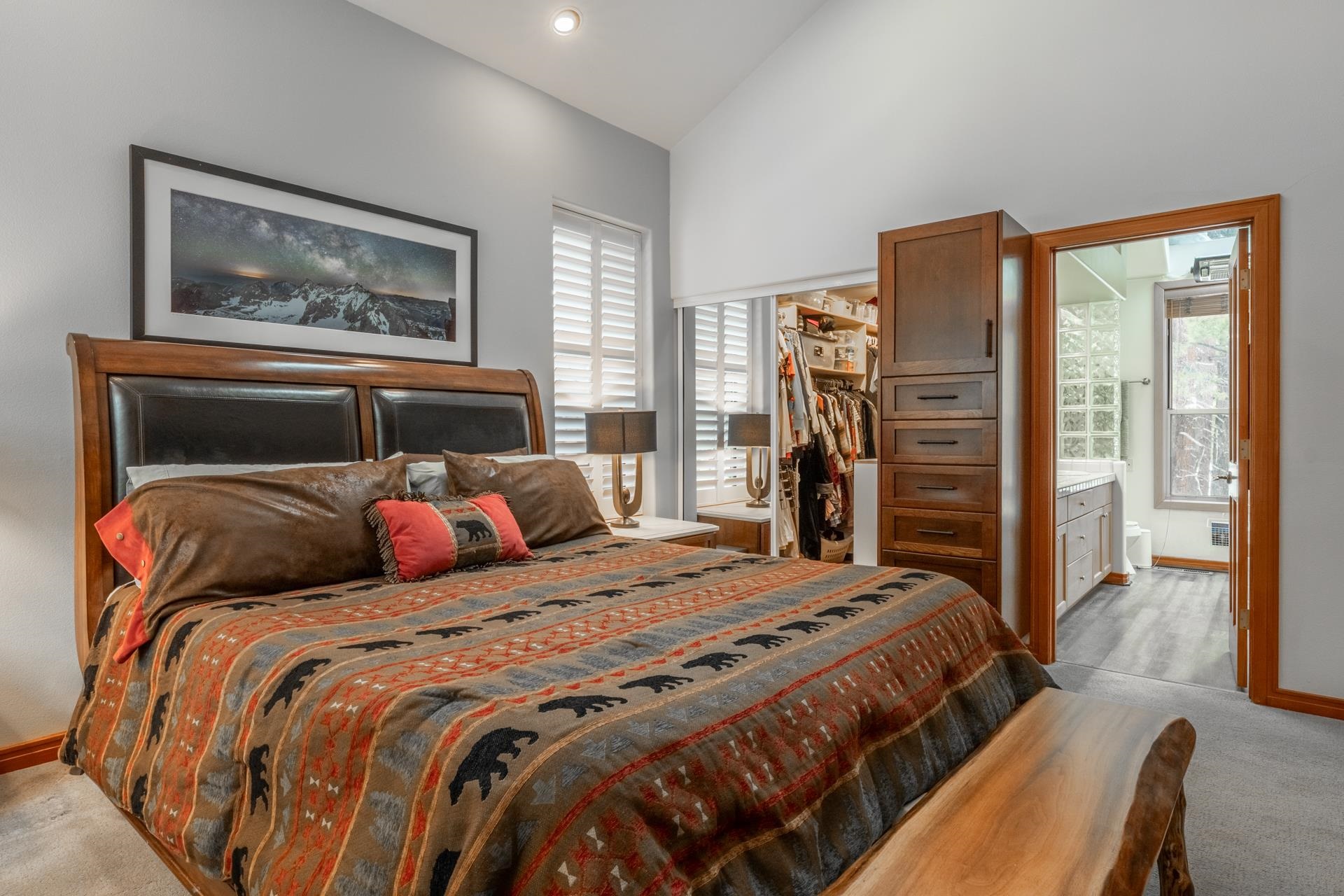 244 Ridge Way Mammoth Lakes, CA 93546 - Photo 31 of 49 Bedroom featuring light colored carpet, lofted ceiling, a walk in closet, and ensuite bathroom