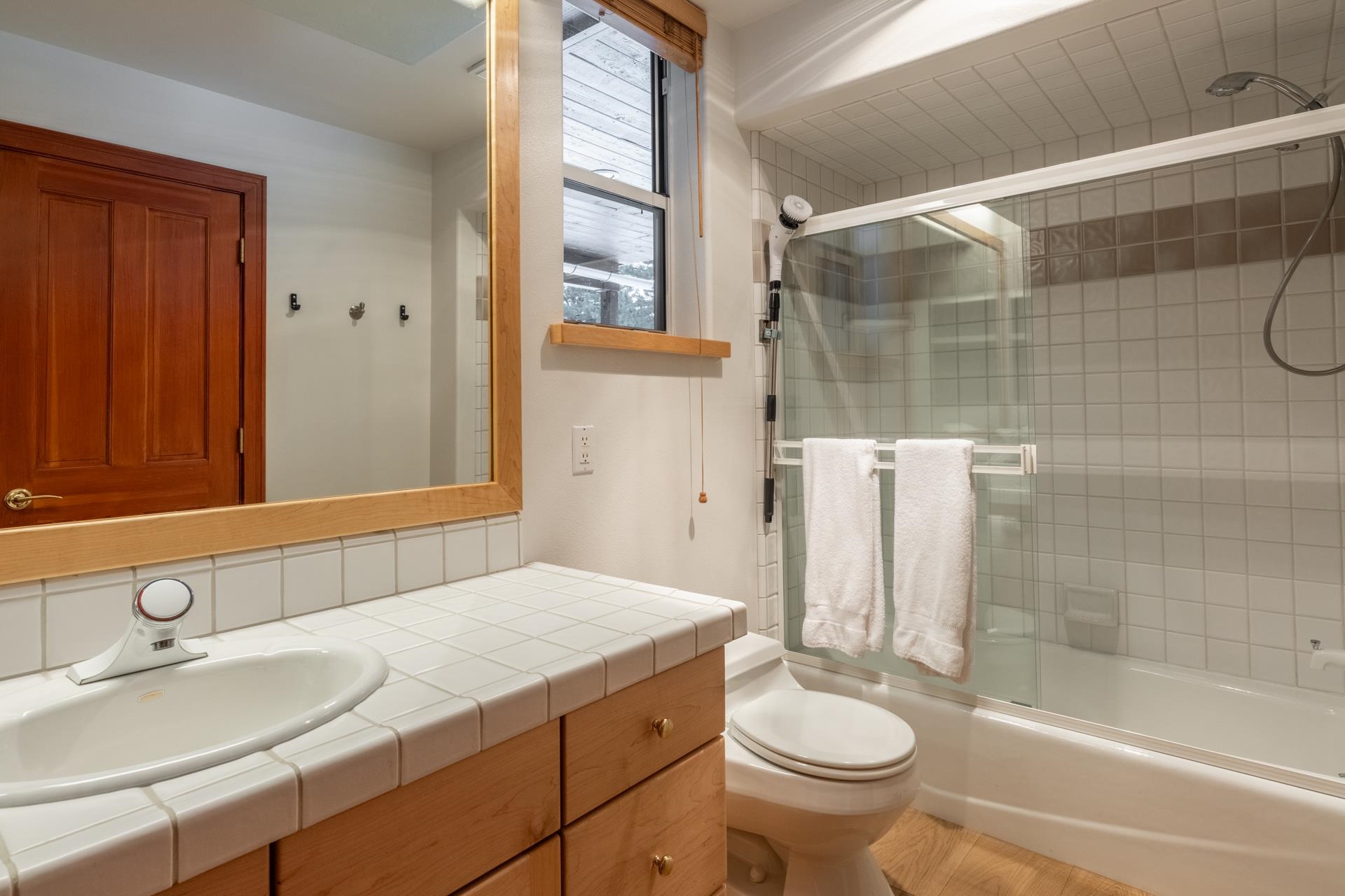 244 Ridge Way Mammoth Lakes, CA 93546 - Photo 42 of 49 Full bathroom featuring vanity, bath / shower combo with glass door, and wood finished floors