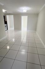 3614 Taylor Street Hollywood, FL 33021 - Photo 10 of 20 a view of a livingroom with an empty space and a window