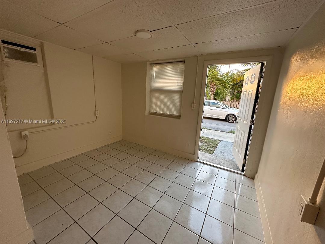 1956 Lincoln Street, Unit 10 Hollywood, FL 33020 - Photo 5 of 9 a view of an empty room and window