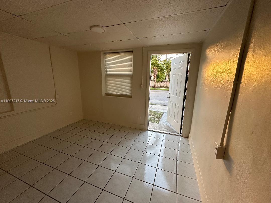 1956 Lincoln Street, Unit 10 Hollywood, FL 33020 - Photo 6 of 9 a view of an empty room and window
