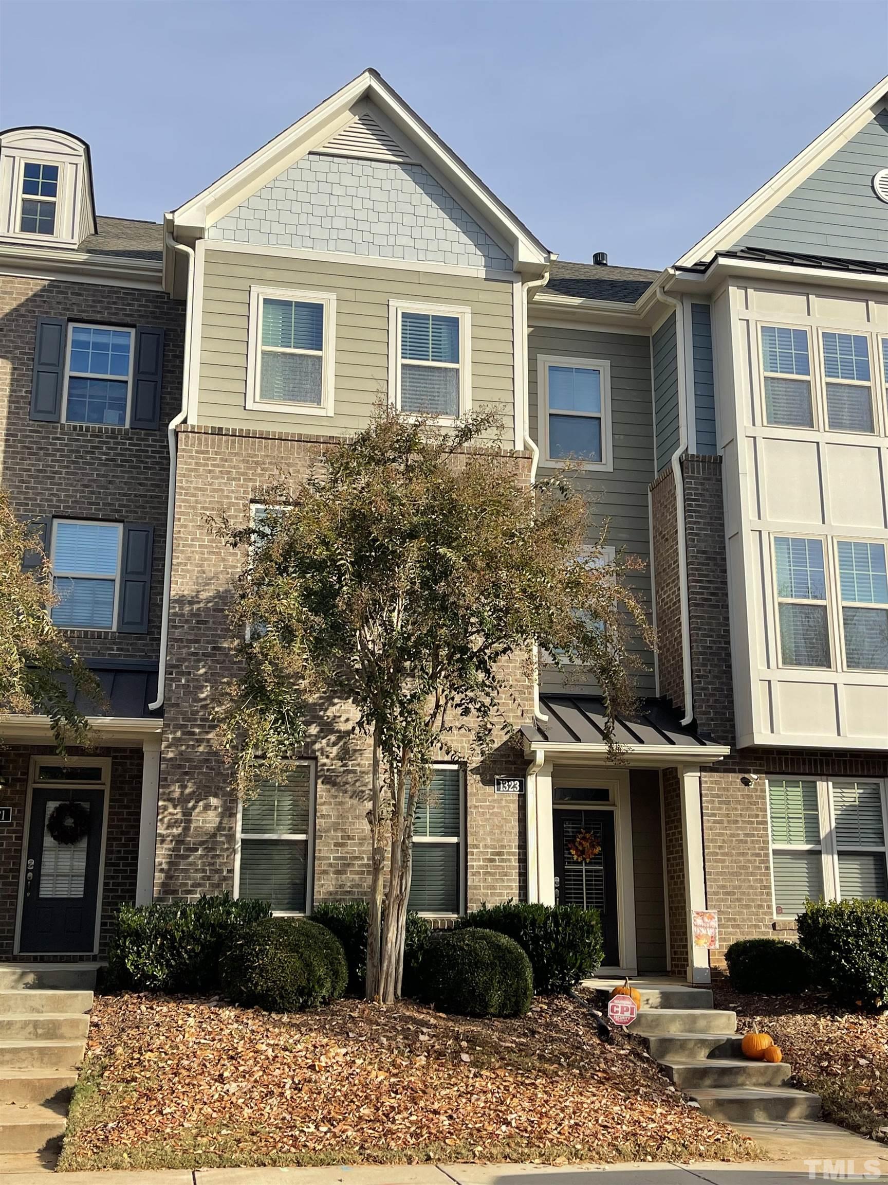1323 Rodessa Run Raleigh, NC 27607 - Photo 1 of 29 a front view of a house with a yard
